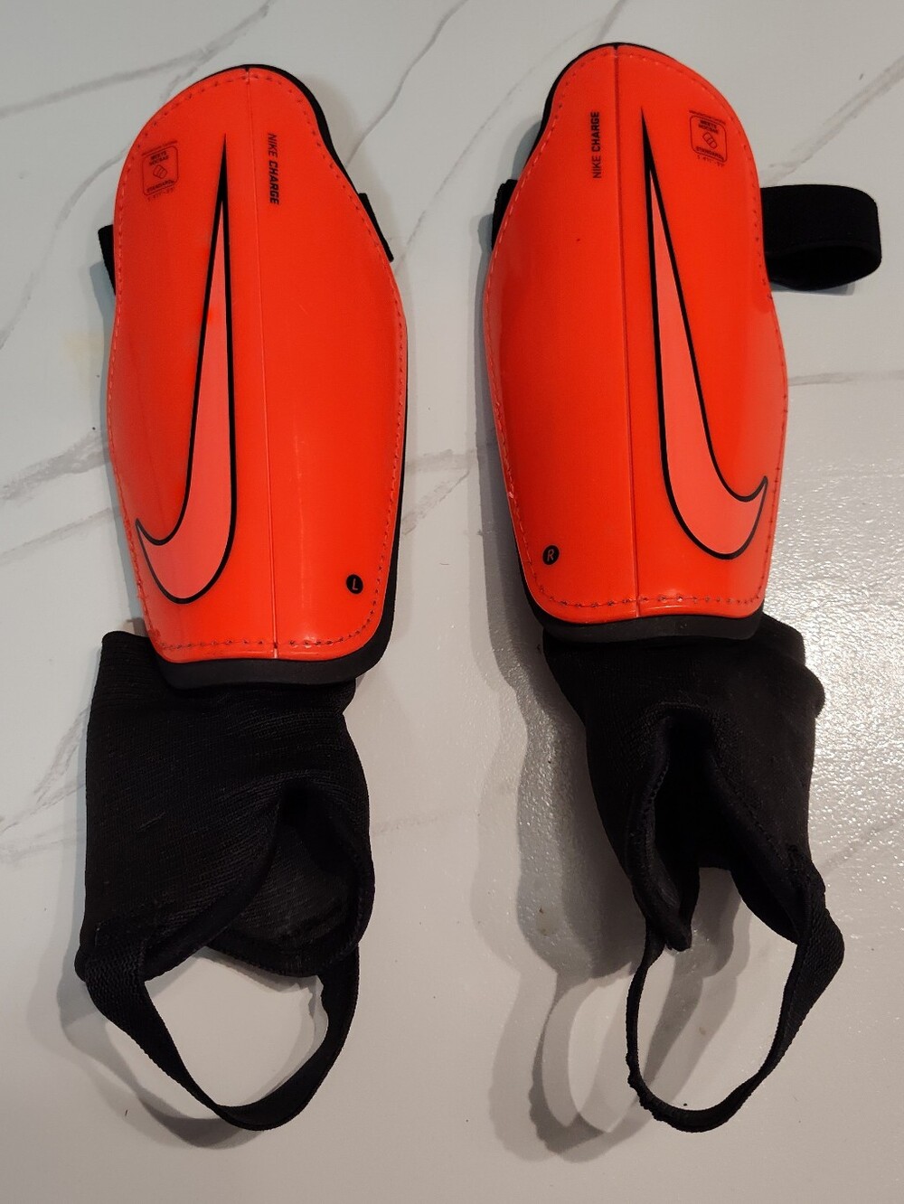 Nike Charge Soccer Shin Guards Pair, Padded, Orange/Black, Size: 4'11" - 5'3"